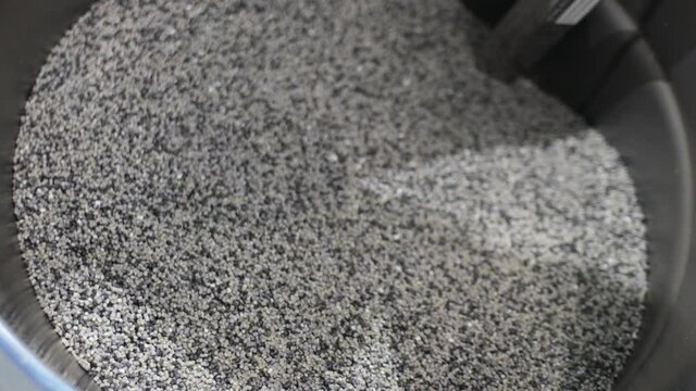 Barrel with polypropylene granules in the technological process. PP Pet Chips Semi Dull, PET chips recycle, PET polyester chips