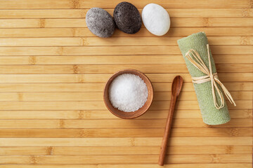 Bath salts natural spa products top view on bamboo wooden texture background with copy space for...
