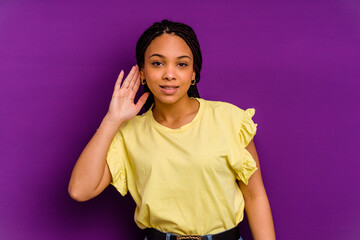 Young african american woman isolated on yellow background Young african american woman isolated on...