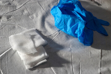 Gloves and gauze on a table 