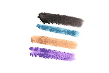 Colorful eyeshadows powder smears isolated on the white background.