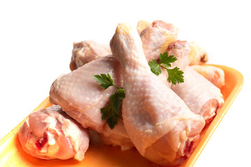 Raw chicken drumsticks with cooking ingredients
