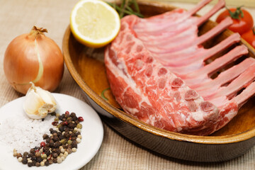 raw lamb chops with different ingredients