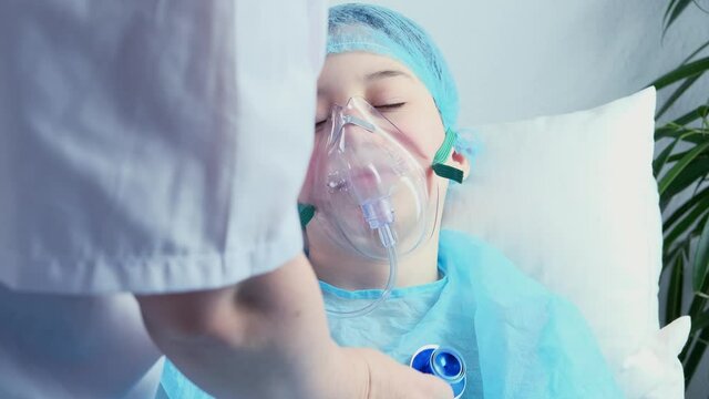 female doctor, pediatrician with a medical stethoscope listens to the lungs of a 8-9 year-old child, little patient, concept of preventive examination, treatment of children