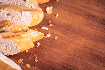 Fototapeta premium Bread and butter for homemade breakfast with coffee tea milk and organic slide whole wheat rye grain flour brown French baguette with bio marmalade jam mix with orange passion fruit apricot