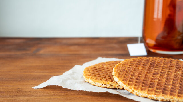 Traditional local signature authentic Dutch Netherlands sweet fresh homemade of delicious tasty stack brown golden waffle caramel honey sugar syrup for dessert in cafe with coffee tea call Stroopwafel