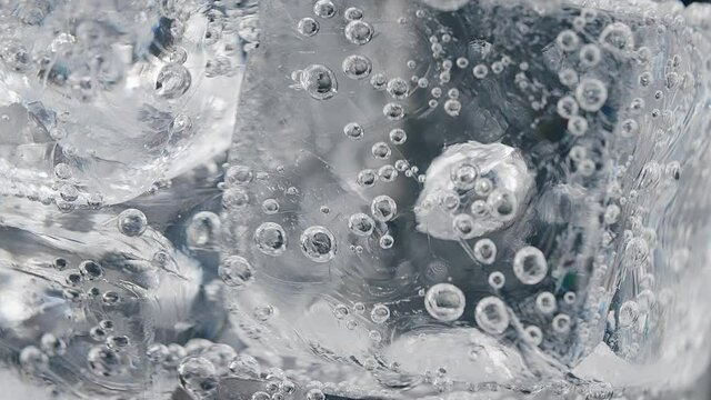 Ice in a glass of water. Macro. High quality 4k footage