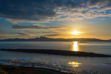 Long exposure photography, mountain landscape, sea bay, small island, the sun is setting
