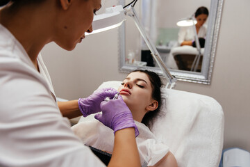 young beautiful woman having an injection mesotherapy