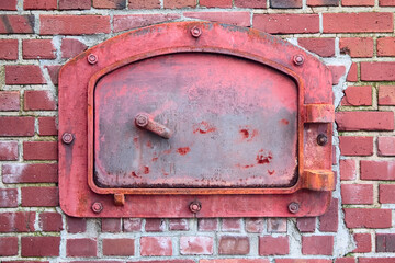 Red Incinerator Door with Red Brick Background - obrazy, fototapety, plakaty