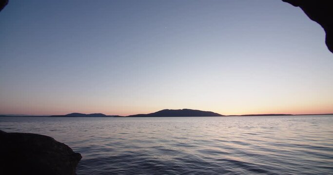 Rocky Pacific Northwest Coastline along puget sound near Seattle Washington with views of San Juan Islands