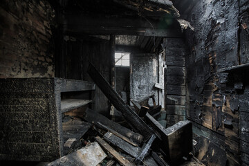 Fototapeta na wymiar Burnt old house interior. Consequences of fire
