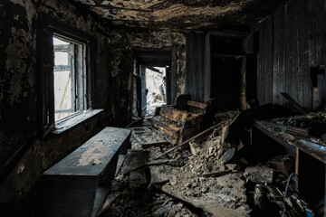 Burnt old house interior. Consequences of fire