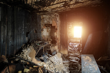 Burnt old house interior. Consequences of fire