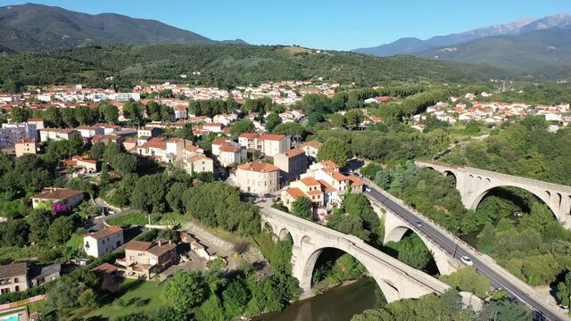 Flight over the city Ceret on summer day. France
