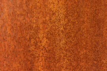 Smooth, slightly rough weathered and rusted orange-red colors surface with rust runs and rust spots. Detailed closeup Rusted metal sheet texture