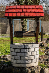 Miniature well with wooden roof