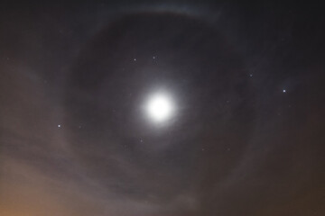 Moon halo and clouds at the night