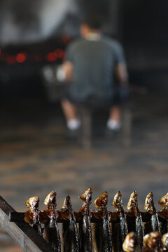 Herrings in smokehouse