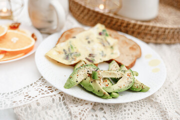 Avocado & omlette in breakfast