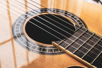 Strings of a guitar, music, guitar sound, acoustic guitar close up