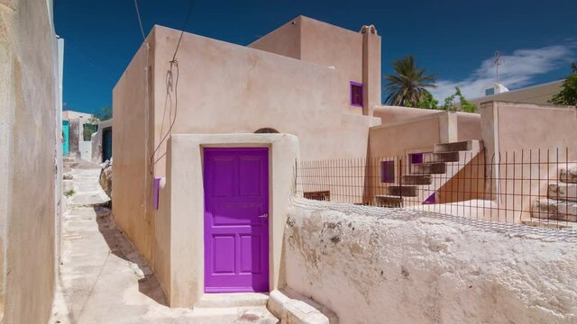 sunny day santorini island fira town street purple door panorama timelapse 4k greece