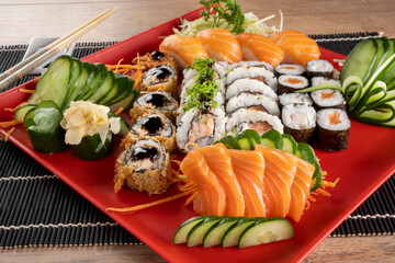 Mixed sushi roll and salmon sashimi
