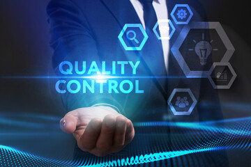Business, Technology, Internet and network concept. Young businessman working on a virtual screen of the future and sees the inscription: Quality control