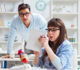 Obraz premium Two medical students studying in classroom