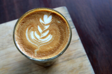 cup of hot latte art coffee