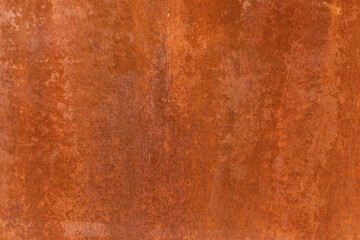 Smooth, slightly rough weathered and rusted orange-red colors surface with rust runs and rust spots. Detailed closeup Rusted metal sheet texture