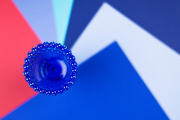 blue cup on colorful background