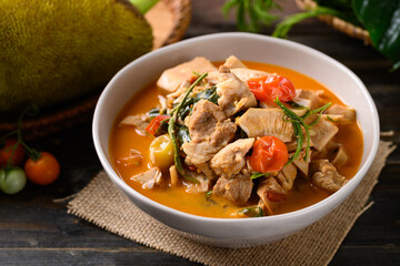 Northern Thai food (Kang Kanoon), Spicy young jackfruit soup with pork in a bowl on wooden table