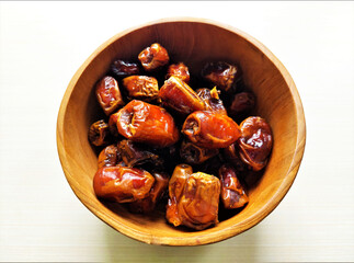 Dates on a wood bowl, iftar concept