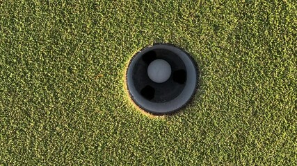 Golf Ball into a Hole - Powered by Adobe