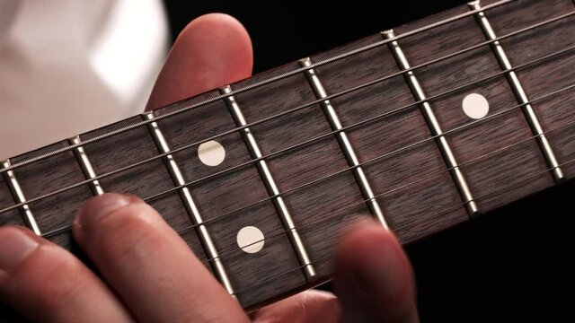 Super close up of a guitar fretboard 