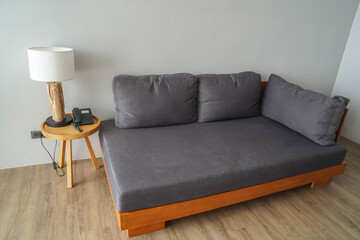 selective focus minimal modern interior of living room with fabric sofa and lamp