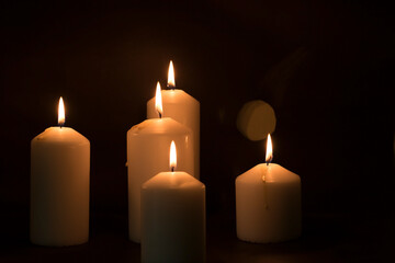 candles that are lit in the dark