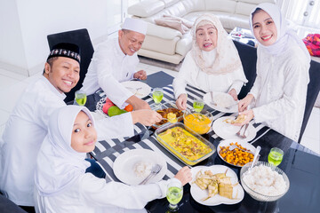 Muslim family having meals together at Eid Mubarak
