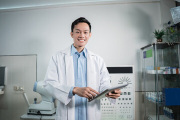 a male doctor maintains an eye checklist that forms the basis of examinations at the eye clinic