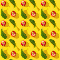 Seamless regular creative pattern from small red apples and green leaves, good autumn harvest.