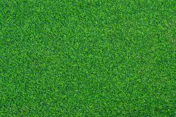 Green artificial grass texture for background. Top view