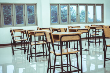 Education learning problem in future and new normal life, School empty classroom no childrens when COVID-19 disease outbreak and closed quarantine, no pupils in school and student study at home.