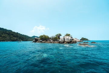 Tropical island and clouds From on the boat