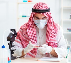 Arab doctor chemist studying new virus in lab