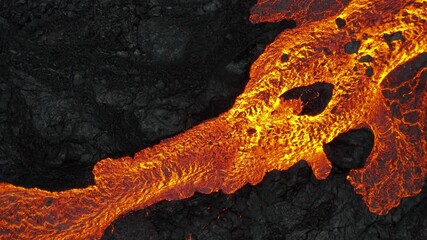lava volcano Spills close shot  , Mount Fagradalsfjall, Iceland
4K drone shot from Iceland of Hot lava and magma coming out of the crater, April 2021 
