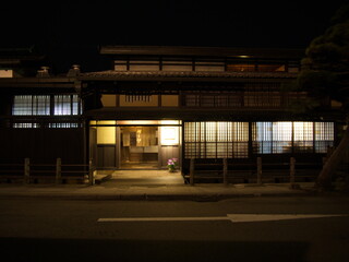 Takayama Old Town, JAPAN - April 11, 2014:  Night view of Sannomachi Street in Takayama ,with old wooden buildings and houses dating from the Edo Period.