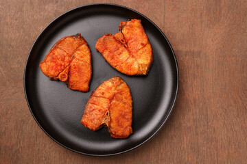 Fried fish, Kerala Fish fry in coconut oil India. Top view of fresh seafood curry served in house boat of Alappuzha. King or Barracuda fry. non vegetarian Indian food.	