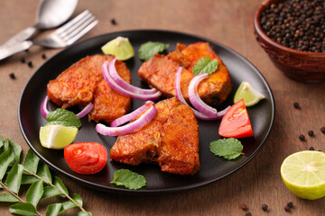 Fried fish, Kerala Fish fry in coconut oil India. Top view of fresh seafood curry served in house boat of Alappuzha. King or Barracuda fry. non vegetarian Indian food.	