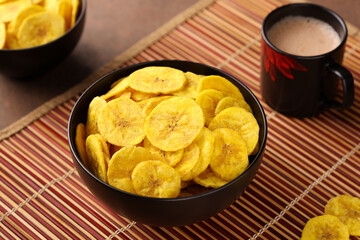 banana chips, popular Kerala snack deep fried in  coconut oil. traditional South Indian tea time snack on banana leaf, Kerala India on Onam, Vishu, Diwali, Ramzan